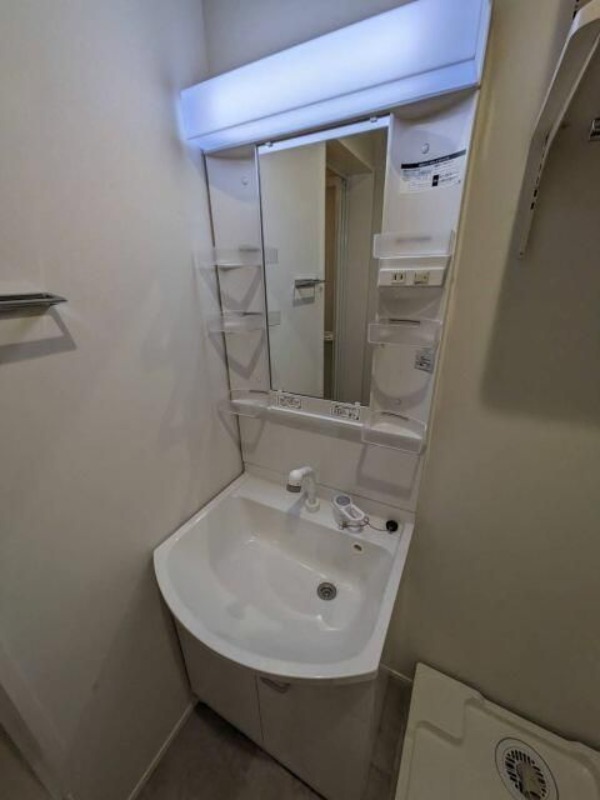 ��ʌ������s�������̃A�p�[�g�̐��ʏ�