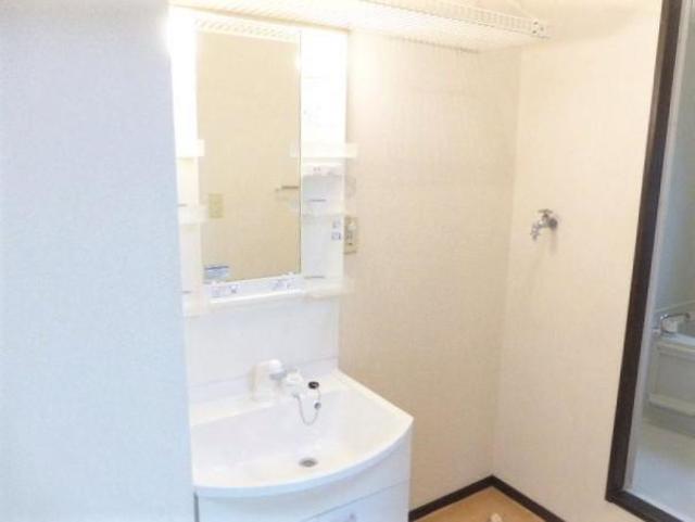 ��ʌ�����s�厚������̃A�p�[�g�̐��ʏ�