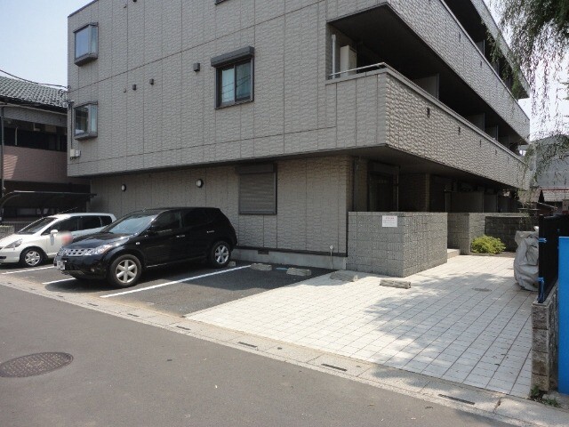 ��ʌ��������܎s��{��㏬���̃}���V�����̒��ԏ�