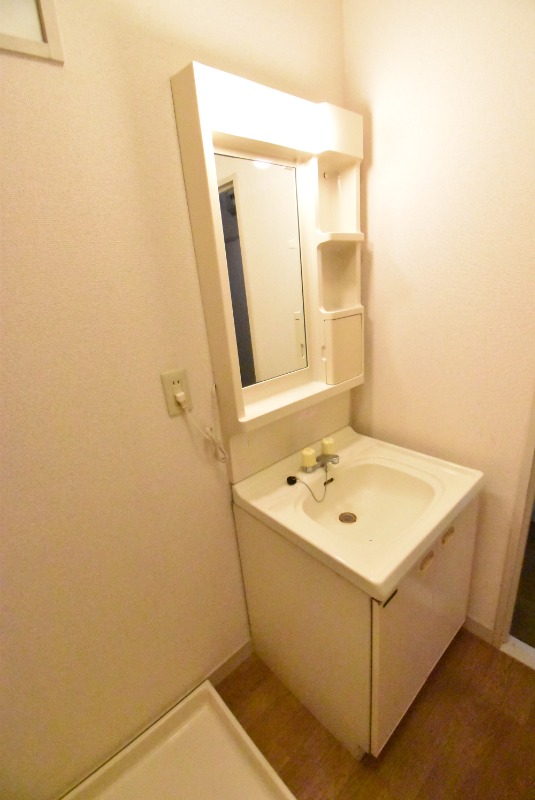 ��ʌ������s�����R���ڂ̃}���V�����̐��ʏ�