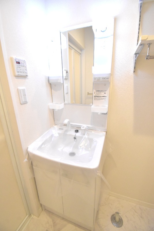 ��ʌ��������܎s��{��x�̓����P���ڂ̃}���V�����̐��ʏ�