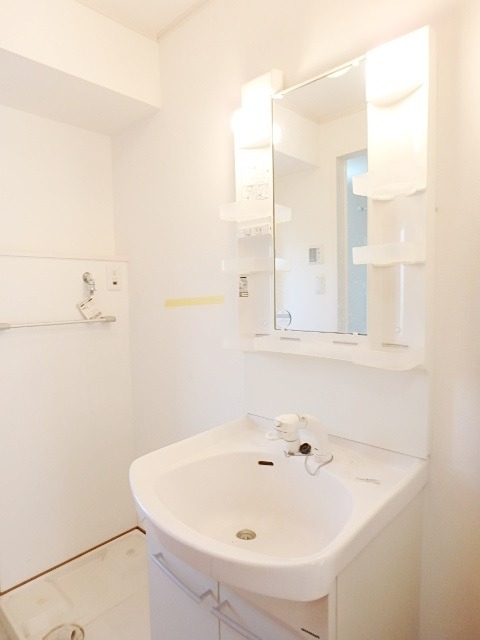 ��ʌ��������܎s��{��㏬���̃A�p�[�g�̐��ʏ�