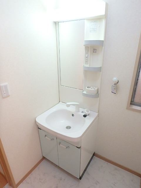 ��ʌ��u�؎s�K���P���ڂ̃A�p�[�g�̐��ʏ�