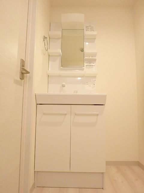 ��ʌ��������܎s��{��㏬���̃}���V�����̐��ʏ�