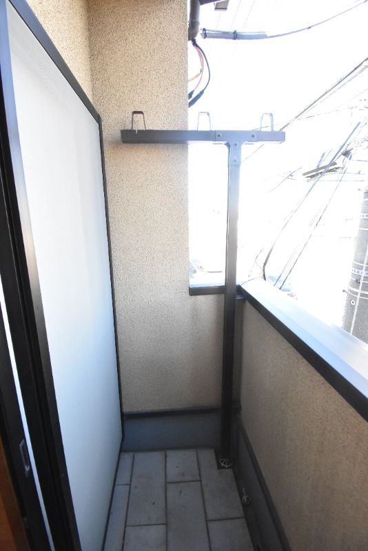 ��ʌ��������܎s��{��V�����P���ڂ̃A�p�[�g�̃o���R�j�[