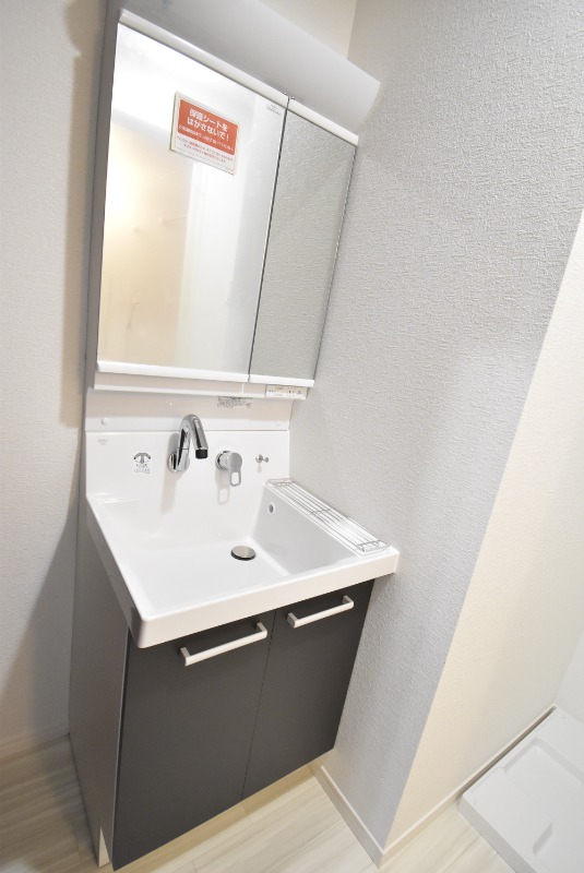 ��ʌ��������܎s��{�擌���P���ڂ̃}���V�����̐��ʏ�