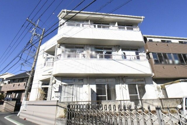 ��ʌ�����s��Z�g20-21�̃}���V�����̌����O��