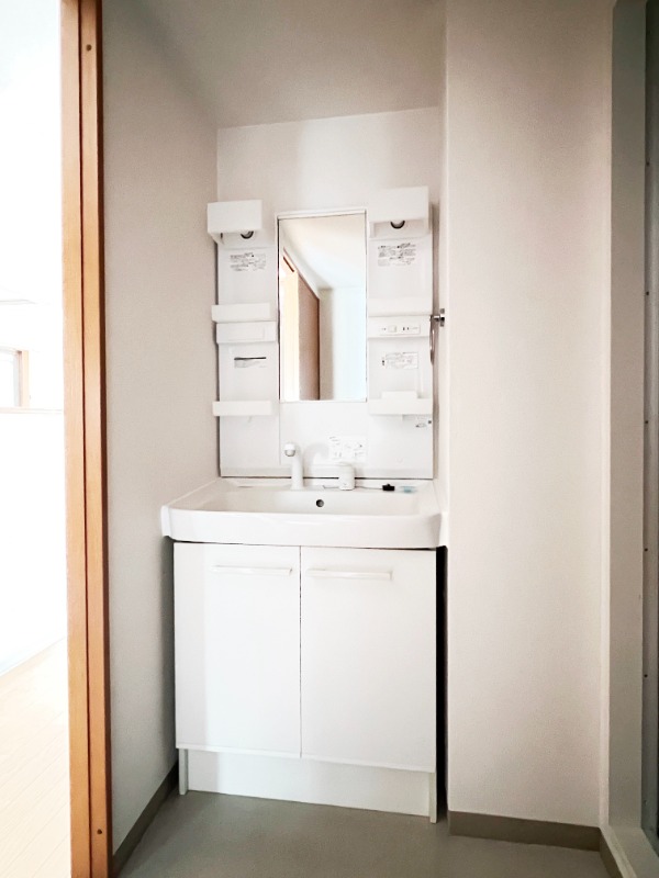 ��ʌ�����s������R���ڂ̃}���V�����̐��ʏ�