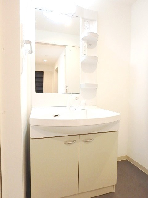 ��ʌ��������܎s��{����ؒ��P���ڂ̃}���V�����̐��ʏ�