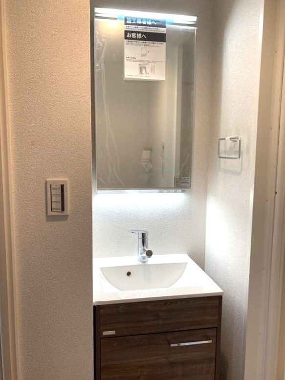 ��ʌ������s�������̃A�p�[�g�̐��ʏ�