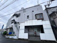 ��ʌ������s��ʖ�1105�̃}���V�����̌����O��